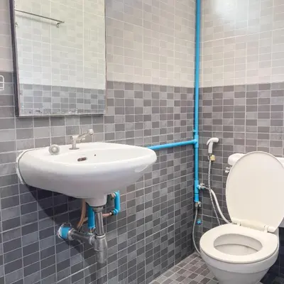 a bathroom with a sink and a toilet at Happy House in Phi Phi Don