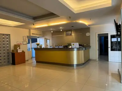 a large lobby with a counter in a building at Patong Tower apartment with a great view in Patong Beach