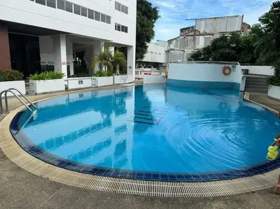 a large pool on the roof of a building at Patong Tower apartment with a great view in Patong Beach