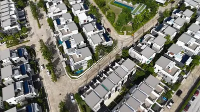 an overhead view of a city with white houses at Big Garden Townhouse Laguna Park in Phuket Town