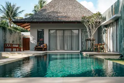 a swimming pool in front of a villa at Allure Villa in Bangtao in Ban Pak Lak