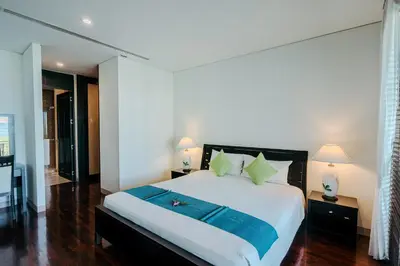 a bedroom with a bed with a blue towel on it at Luxury Penthouse Apartment 8C at Kata Gardens in Kata Beach