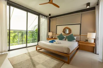 a bedroom with a large bed and a large window at New Ultra Modern Designer Furniture Gym #v62 in Chalong