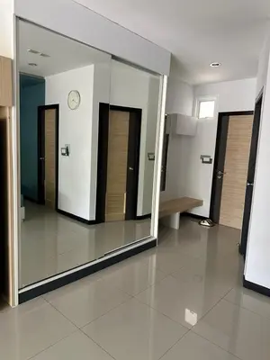 a large mirror in a hallway with several doors at Nai Harn Beach Condo (C2) in Rawai Beach