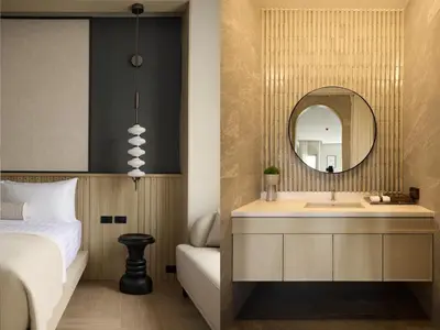 a bedroom with a sink and a mirror at Arco Phuket Town in Phuket Town