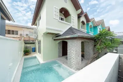 a villa with a swimming pool in front of a house at Bangla Patong Pool Villas with 4 Villas different designs choose fro, photo before Book in Patong Beach