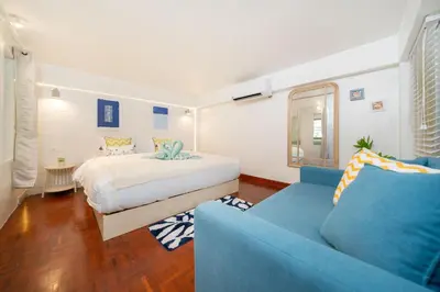a bedroom with a bed and a blue couch at Bangla Patong Pool Villas with 4 Villas different designs choose fro, photo before Book in Patong Beach
