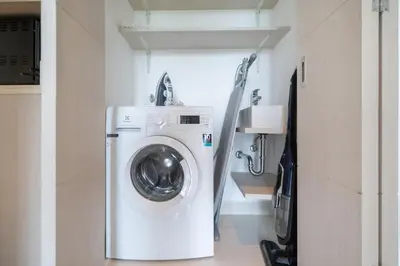 a washer and dryer in a small room at Deluxe apartment at Cassia Residences by Lofty in Bang Tao Beach