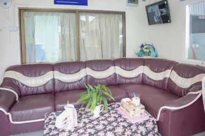 a purple leather couch in a living room with a table at OYO 681 Paradise Hotel in Ao Nang Beach