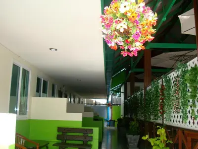 a room with flowers hanging from the ceiling at Nayai Resort in Chalong