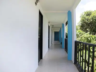 a hallway of a house with blue and white walls at OYO 1075 The View at Naiyang in Nai Yang Beach