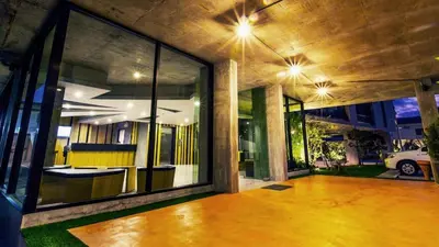 a large room with large glass windows at B2 Phuket Boutique & Budget Hotel in Ban Sam Kong