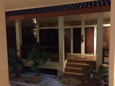 a house with stairs and plants in front of it at Chaya Resort in Ao Nang Beach