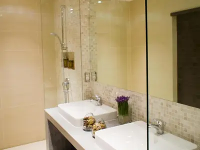 a bathroom with a sink and a shower at Sansuri Resort in Surin Beach