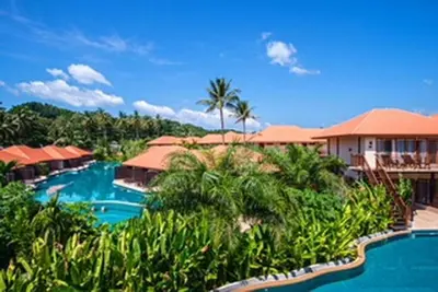 a resort with a swimming pool and palm trees at Blue Koh Yao Yai Resort and Villa in Ko Yao Yai