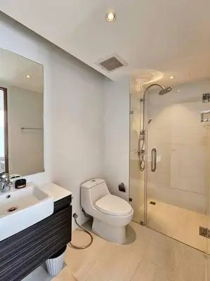 a bathroom with a toilet and a sink and a shower at Seaview room nice sunset Patong in Patong Beach