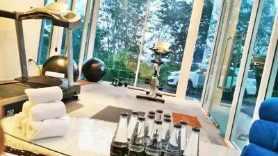 a room with a table with a group of wine bottles at Royal Lee Resort and Spa in Ban Bo Han