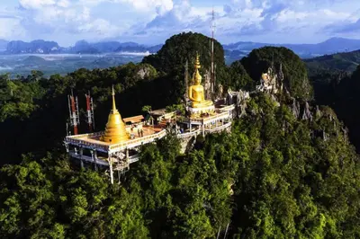 a building on top of a mountain in the forest at Stunning sea view apartment with pool in Ao Nang Beach