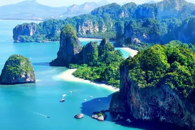 an aerial view of a beach with rocks in the water at Stunning sea view apartment with pool in Ao Nang Beach