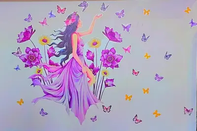 a painting of a woman with flowers and butterflies at Hack Patong Beach Hotel in Patong Beach