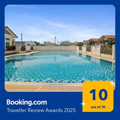 a large swimming pool in a building at Spacious Family Garden Villa - Huge Pool & Gym Access in Thalang