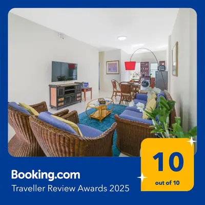 a living room with a couch and chairs at Spacious Family Garden Villa - Huge Pool & Gym Access in Thalang