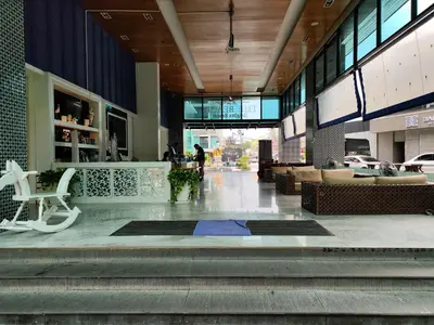 a lobby of a building with people walking in it at 7 Floor - Studio Room at TBHR near Kata beach in Kata Beach