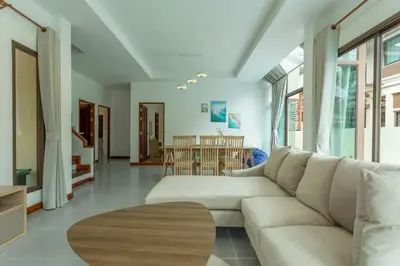 a living room with a white couch and a table at Center Stay from Patong Bangla Walking Street V107 in Patong Beach