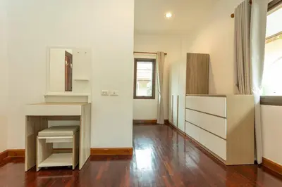 a room with white walls and a wooden floor at Center Stay from Patong Bangla Walking Street V107 in Patong Beach