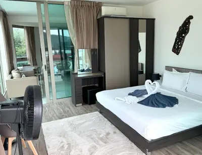 a hotel room with a bed and a camera at Apartment with panoramic views at Oceana by Lofty in Kamala Beach