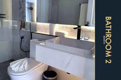 a bathroom with a white sink and a toilet at Luxury Apartment at a Bargain in Kamala Beach