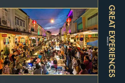 a crowd of people walking around a crowded street at Luxury Apartment at a Bargain in Kamala Beach