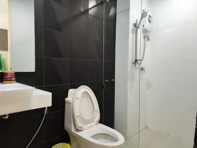 a bathroom with a toilet and a shower at 7 Floor - Mountain view Studio room at OZC near Kata beach in Kata Beach