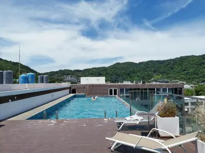 a swimming pool on the roof of a building at 7 Floor - Mountain view Studio room at OZC near Kata beach in Kata Beach