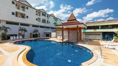 a swimming pool with a gazebo next to a building at Diamond Place Ao Nang in Ao Nang Beach