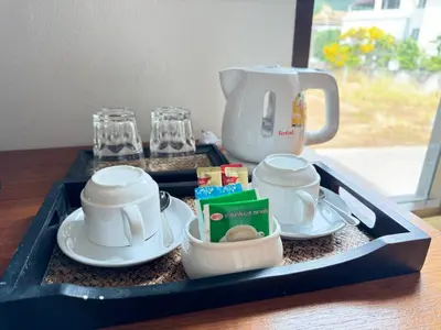a tray with a coffee maker and cups on a table at Diamond Place Ao Nang in Ao Nang Beach