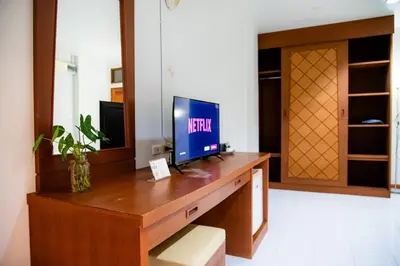 a wooden desk with a television on top of it at Diamond Place Ao Nang in Ao Nang Beach