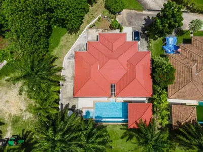 an overhead view of a house with a red roof at Coco Golf Villa in Ban Huai Luk (1)