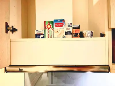 a shelf in a kitchen with food items on it at Studio Apartment 400m from Rawai Beach in Phuket Town
