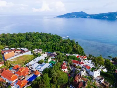 an aerial view of a village on the shore of a lake at Vipa Seaview Villa in Patong Beach