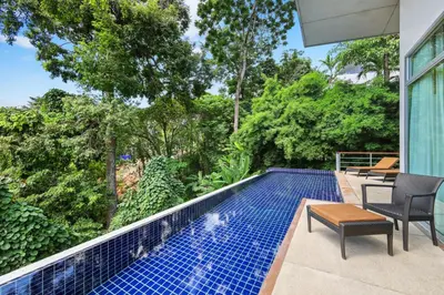 a swimming pool in the backyard of a house at Kamala Hills Naka - Villa 15 in Kamala Beach