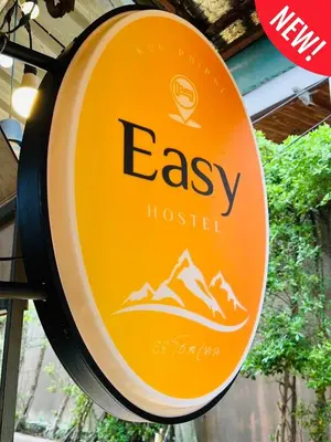 a sign for an essex hospital with mountains on it at Easy Hostel in Phi Phi Don