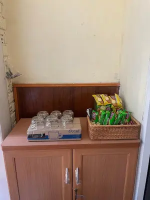 a cabinet with drinks and snacks on top of it at Easy Hostel in Phi Phi Don