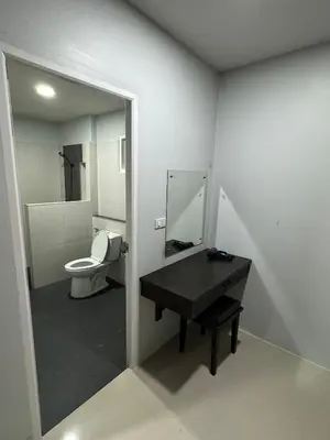 a bathroom with a toilet and a sink and a mirror at Mimi Home in Ko Yao Noi