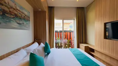 a hotel room with a bed and a television at Kamala Garden View Villas by Aladdin in Kathu