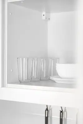 a shelf with three glasses and plates on it at Title V Palm View 4fl Pool Gym Hammam in Rawai Beach
