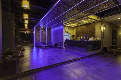 a lobby with purple lighting in a building at Escape Villa in Ban Bang Khu