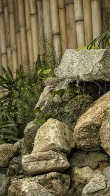 a pile of rocks in front of a building at Bambus Restaurant, Bar & Glamping in Patong Beach