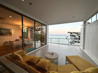 a living room with a couch and a view of the ocean at 4bedroom Villa Siray Beach Front in Phuket Town