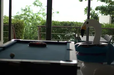 a pool table with a swan on top of it at 4bedroom Villa Siray Beach Front in Phuket Town